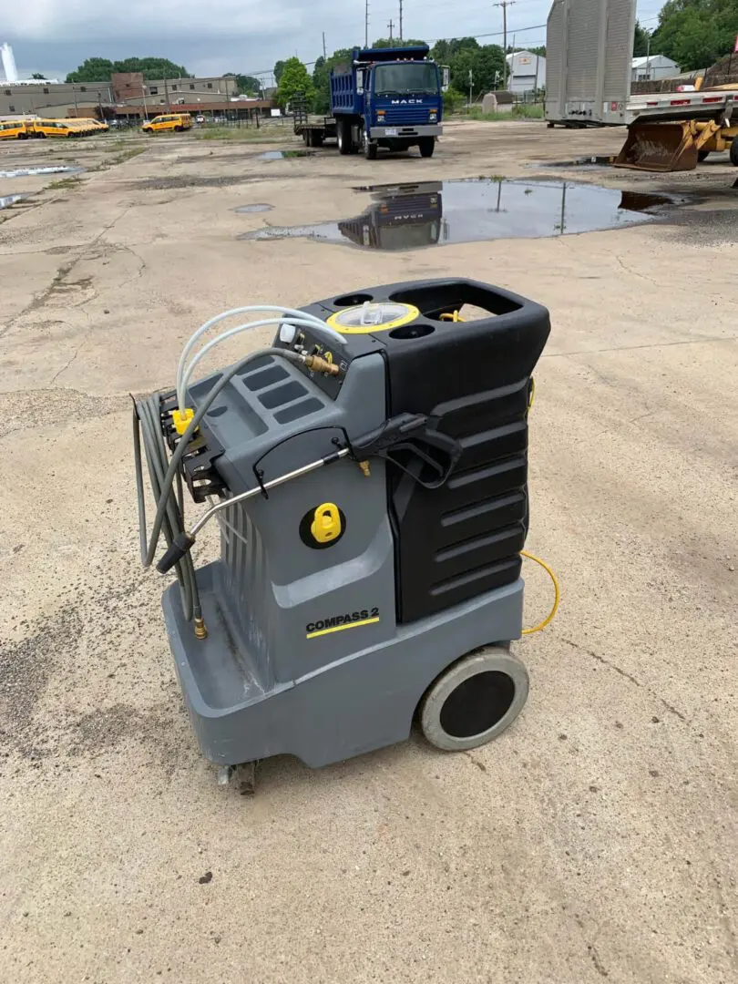 Industrial cleaning machine on outdoor surface.