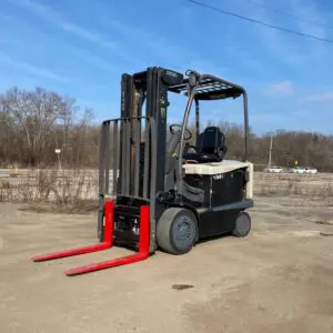 Forklift parked outdoors on a sunny day.